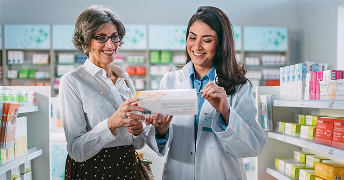Pharmacist helping a customer.